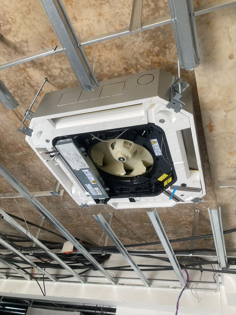 Cassette AC unit being installed
